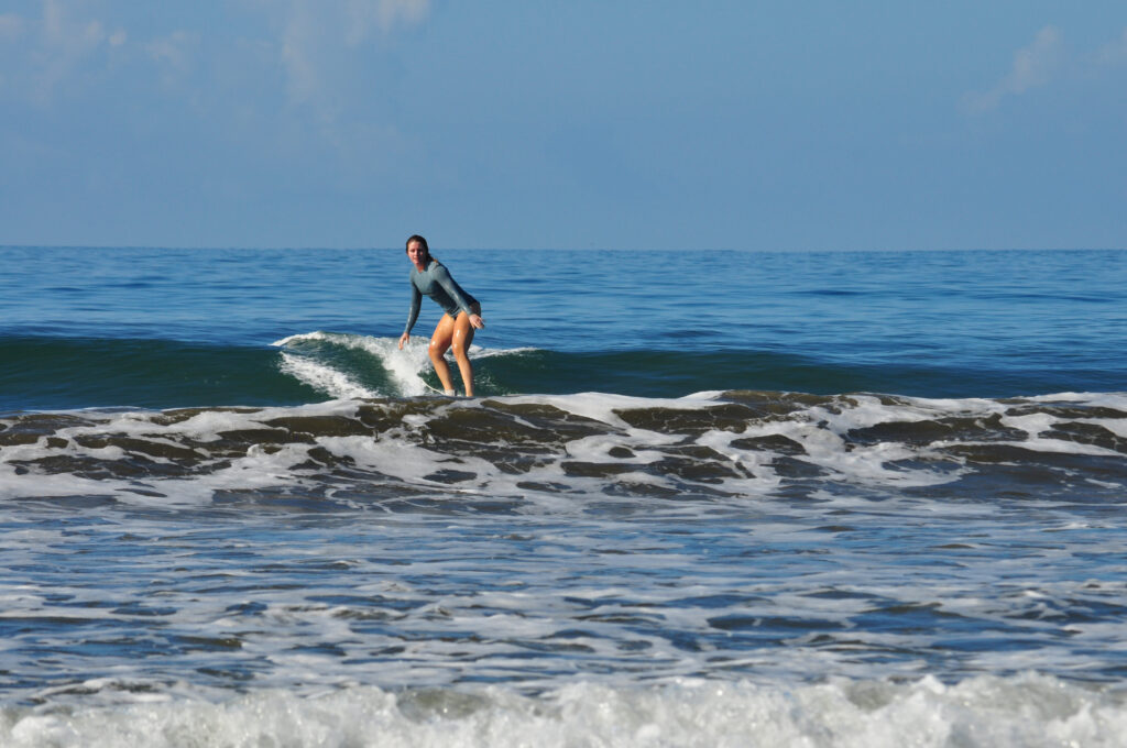 Surfing in the Marino Ballena National Park in Uvita, Osa, Costa Rica