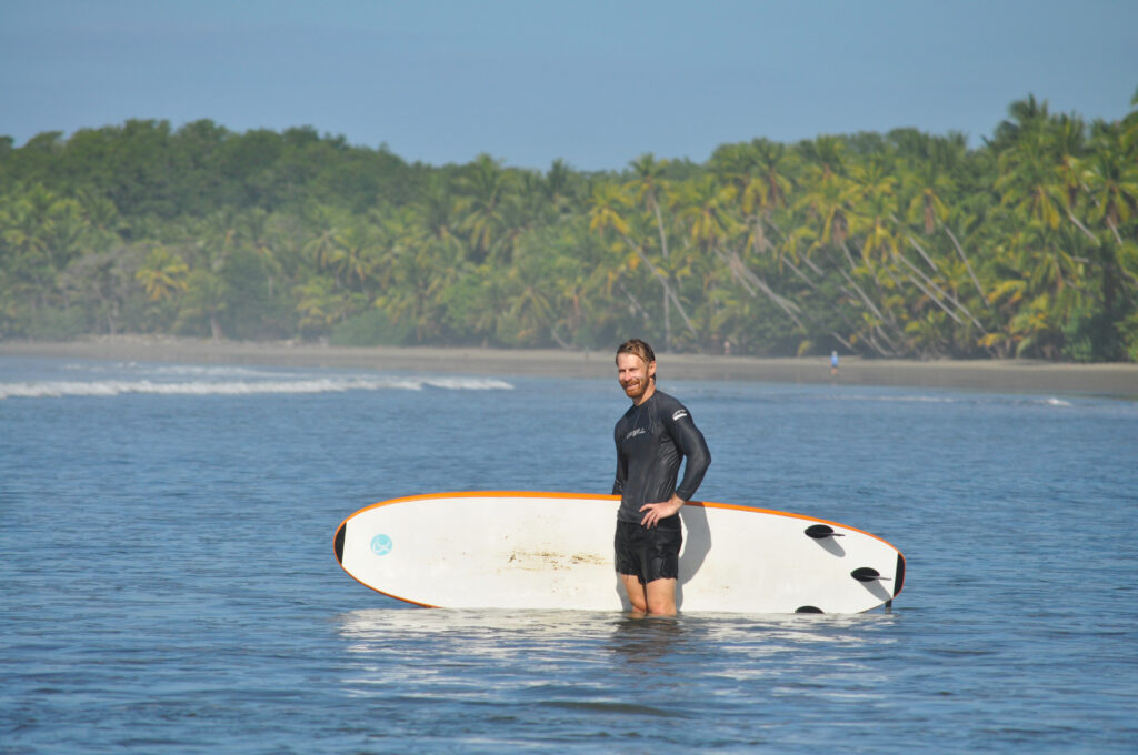 Surfing in the Marino Ballena National Park in Uvita, Osa, Costa Rica